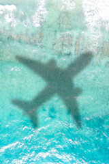 Fototapeta na wymiar Travel traveling vacation sea symbolic picture airplane flying copyspace copy space Seychelles portrait format water