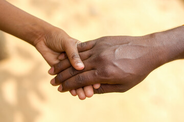 a son holding his father's hand.father son realtionship.happy fathers day.