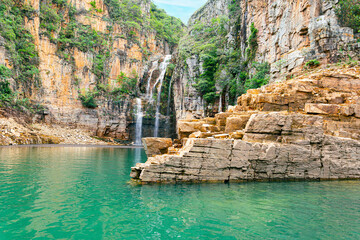 Landscape of Canyons of Furnas and the waterfall, Capitólio MG, Brazil. Green water of the lake between big sedimentary rocky walls. Mar de Minas, eco tourism destination of Minas Gerais state.