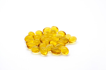 Close up vitamin D3 gel capsules on white background.