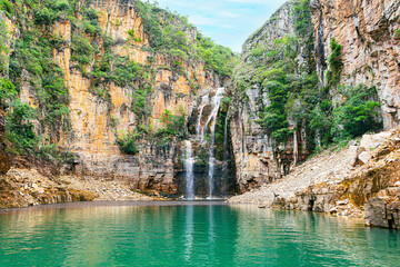 Landscape of Canyons of Furnas and the waterfall, Capitólio MG, Brazil. Green water of the lake between big sedimentary rocky walls. Mar de Minas, eco tourism destination of Minas Gerais state.