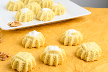 mahmoull a typical arabic sweet isolated on yellow background