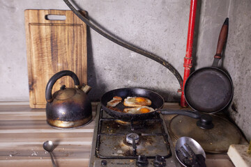 Dirty gas stove. Fat, rust on the surface.