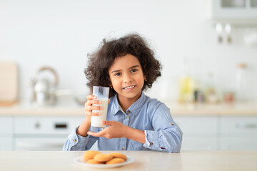 Cute Little Afro Girl Drinking Milk From Glass