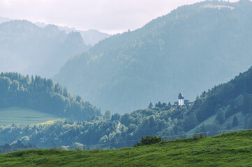 Mountain landscape with white tower