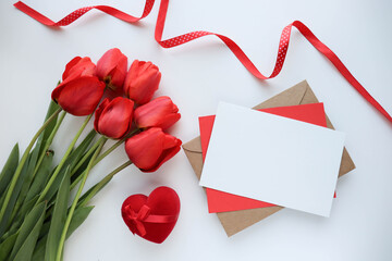 mockup greeting card. beautiful bouquet of tulips and space for text. envelope and white blank 
