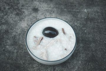 Porridge with chicken, mushroom and preserved egg.
