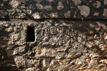 Natural stone wall texture. Patterns and textures of a natural stone wall.