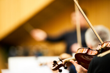 Play the violin. Musical instrument with the hands of the performer. The orchestra with the...
