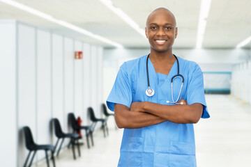 Laughing mature adult african american male nurse at vaccination station for vacinating patients