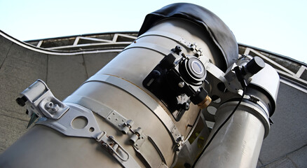 Optical telescope under dome of astronomic observatory