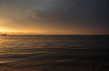 sunset over the sea located on the beach of Cachoeira do Bom Jesus, Canasvieras, Ponta das Canas, Florianopolis, Santa Catarina, Brazil, Florian&oacute;polis