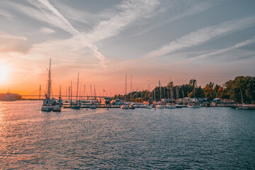 Motor and sailing yachts are moored in the marina of the yacht club. Saint-Petersburg.