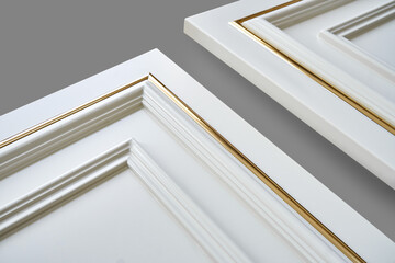 Furniture white facade panels with molding decorative strip in classical style isolated on gray background