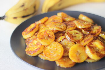 Caramelised plantain slices. A traditional tea time snack from Kerala.Cut ripe plantain into slices...