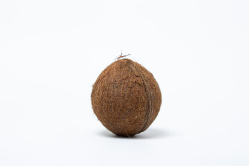 Isolated coconut on a white background. One coconut in the center of the image. Healthy food