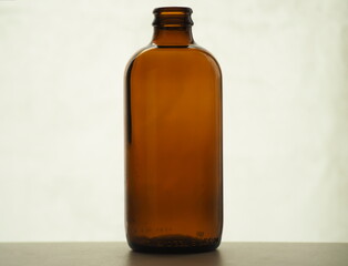 Brown medicine bottle. Brown glass bottle on the shelf