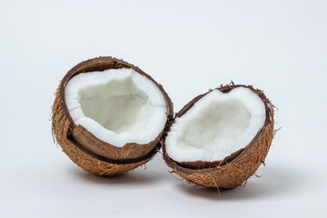 Isolated coconut on a white background. Two halves of a coconut. Healthy food