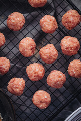 Raw home made Italian traditional meatballs