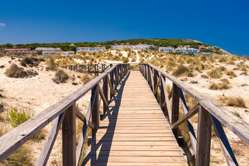 Fototapeta na wymiar A hiking trail path among dunes near Cala Mesquida on Mallorca island in Mediterranean Sea