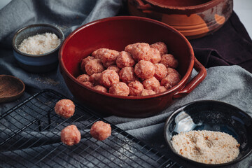 Raw home made Italian traditional meatballs
