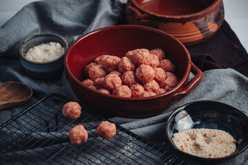Raw home made Italian traditional meatballs