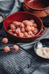Raw home made Italian traditional meatballs