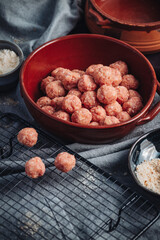 Raw home made Italian traditional meatballs