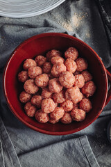 Raw home made Italian traditional meatballs