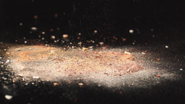 shiny powder falling on beige cosmetic product on black