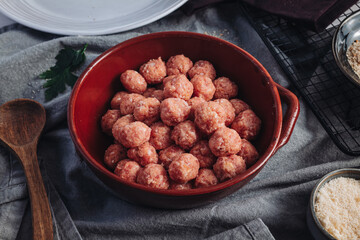 Raw home made Italian traditional meatballs