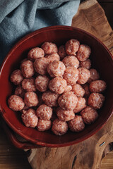 Raw home made Italian traditional meatballs