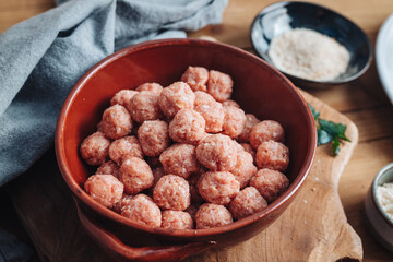 Raw home made Italian traditional meatballs