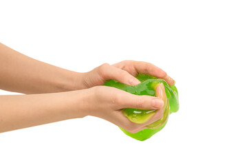 Green slime toy in woman hand isolated on white background.