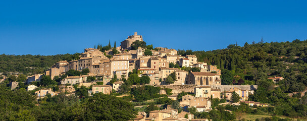 Obraz premium Panoramic view the village of Simiane-la-Rotonde in summer. Alpes-de-Hautes-Provence, Alps, France