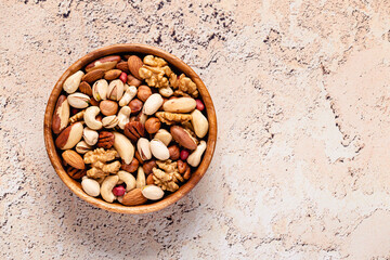 Various Nuts in wooden bowl