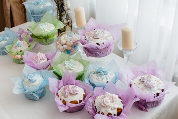 Beautiful Easter cakes on a decorated light table. A light holiday of Easter.