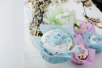Beautiful Easter cakes on a decorated light table. A light holiday of Easter.