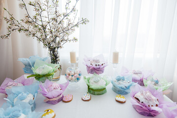 Beautiful Easter cakes on a decorated light table. A light holiday of Easter.