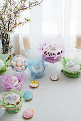 Beautiful Easter cakes on a decorated light table. A light holiday of Easter.