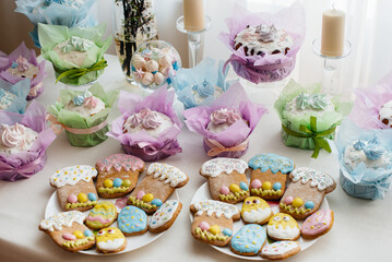 Beautiful Easter cakes on a decorated light table. A light holiday of Easter.