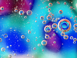 blurry abstract background of colored soap bubbles in water
