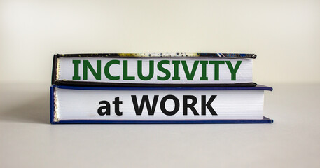 Inclusivity at work symbol. Books with words 'Inclusivity at work' on beautiful white background. Business, inclusivity at work concept. Copy space.