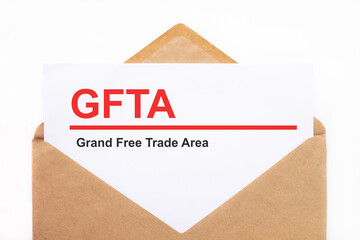 Fototapeta na wymiar A white sheet with the text gfta out of debt lies in an open craft envelope on a white background with copy space. Business concept image