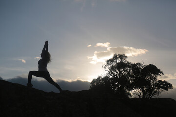 outdoors yoga meditation silhouette in the sky