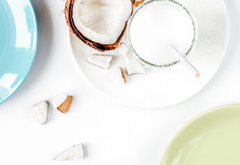 cocktail with coconut on white background top view