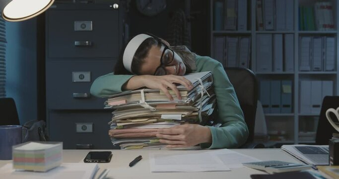 Tired office worker sleeping at work