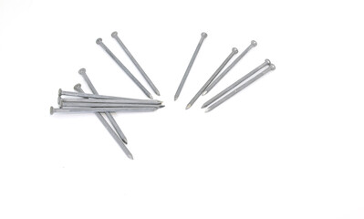 several large nails on a white background