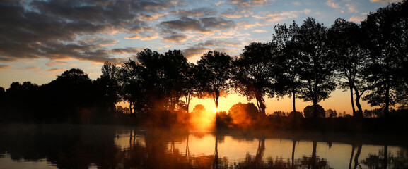 Sunset on a foggy sea