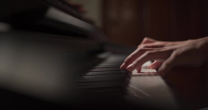 Close up of finger musician at the piano , The pianist playing  piano in the room ,classic piano.hobby